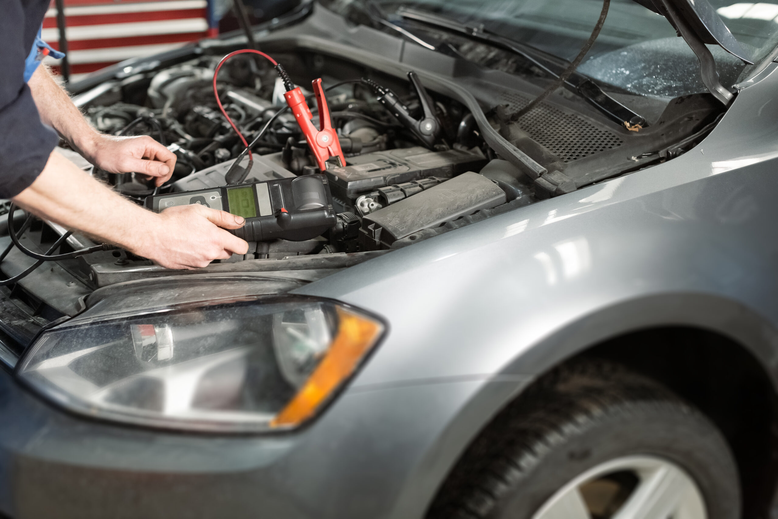Professional mobile mechanic servicing a vehicle