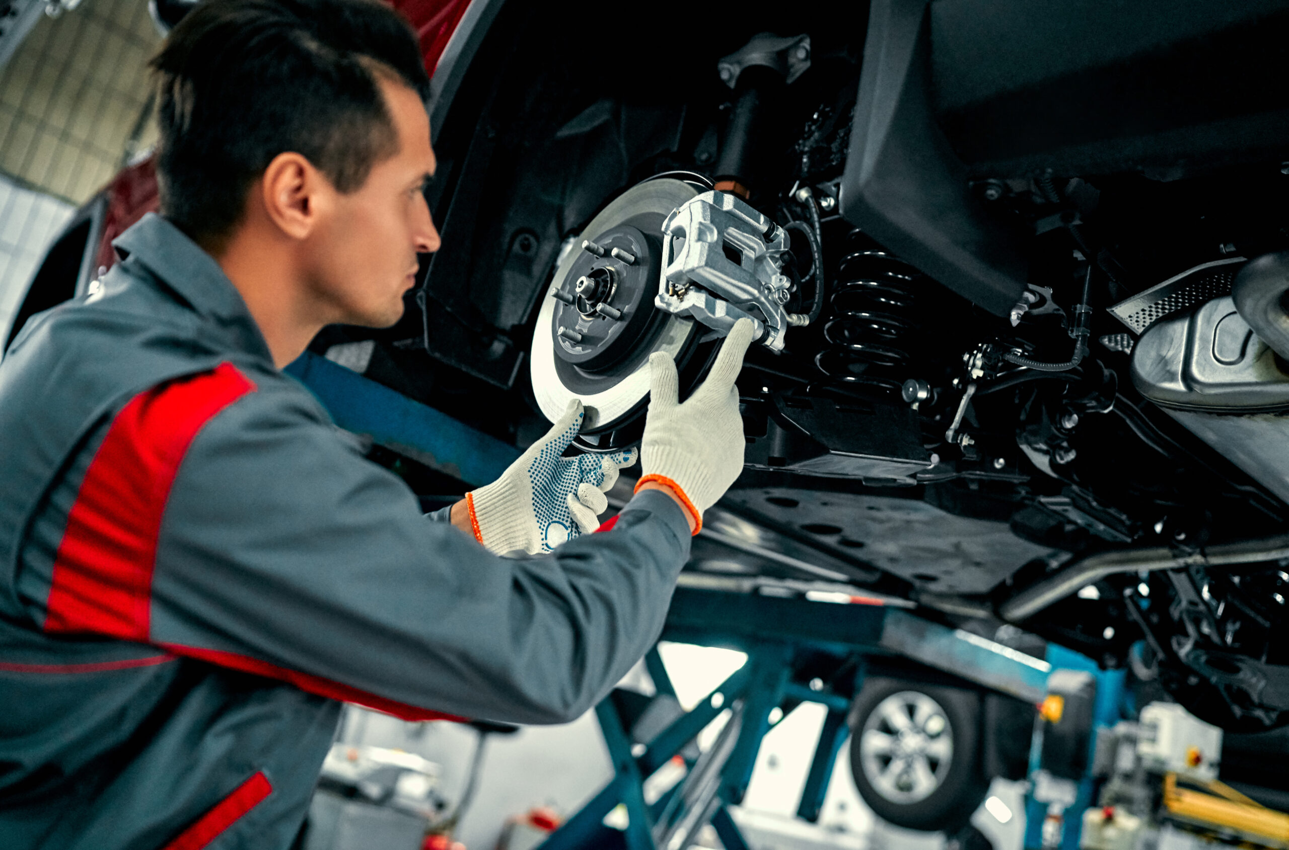Professional mobile mechanic servicing a vehicle
